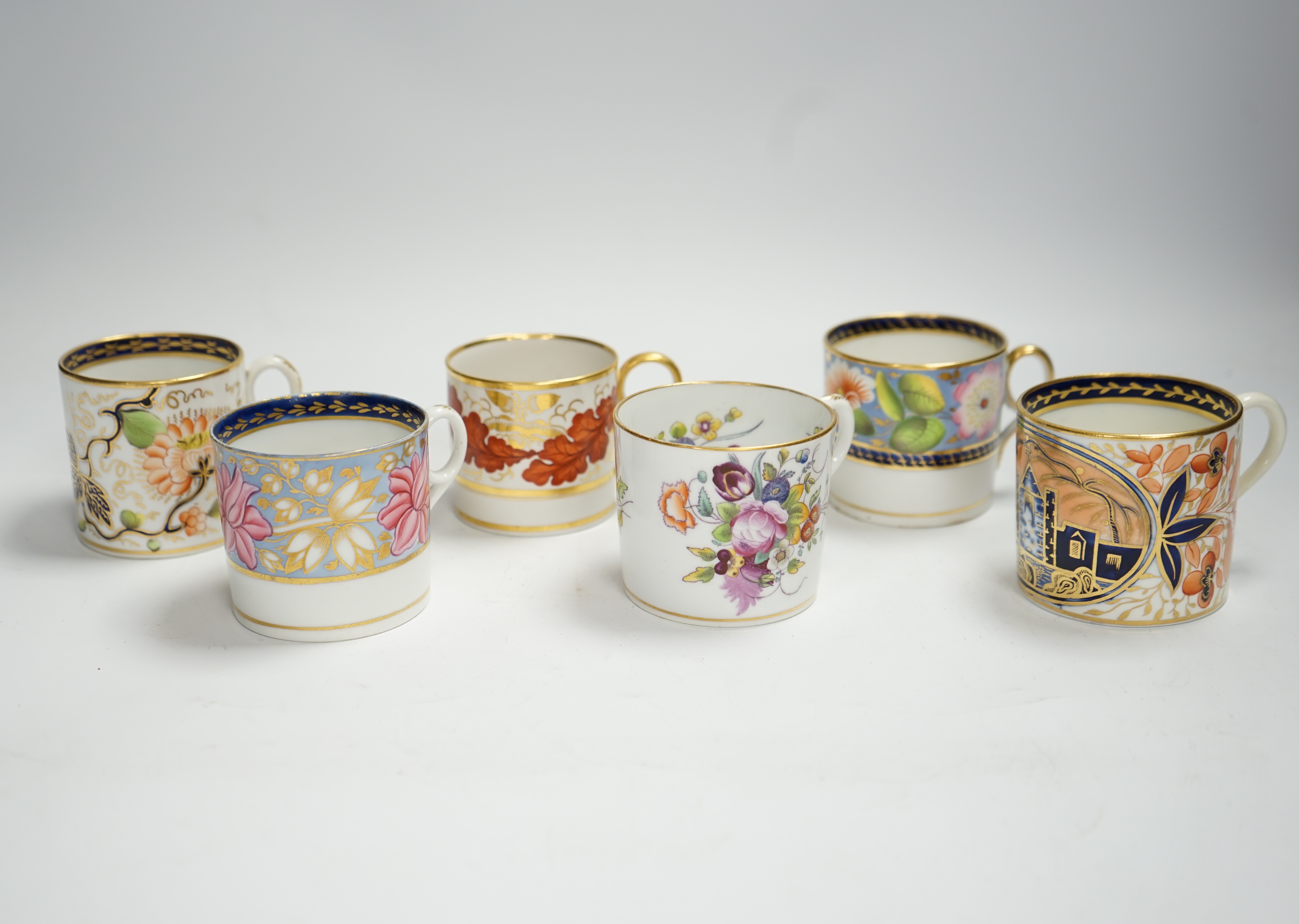 Twelve 1800-1820 English porcelain floral designed coffee cans